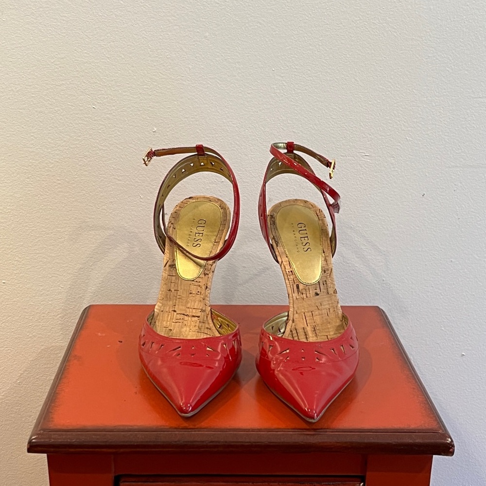 Red point toe strap heels.